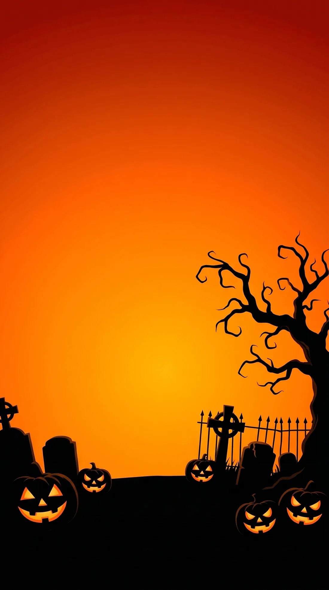 A graveyard with a stone crypt at sunset