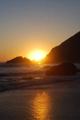 Vertical Sunset Over Ocean Rocks